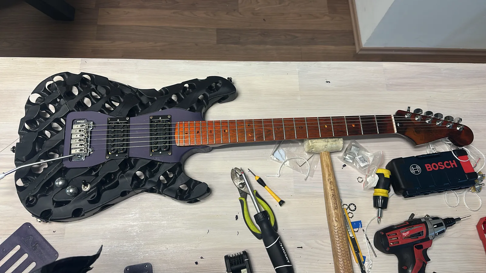 Finished guitar — ready to play. Fully assembled instrument with neck, pickups, electronics and surface finish — fully tuned and functional